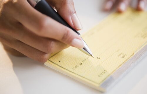 The Federal Reserve says it is considering "winding down" its processing of paper checks for banks and their customers.