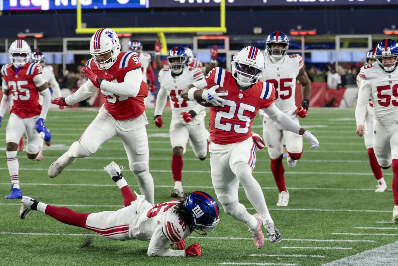 <i>Maddie Meyer/Getty Images North America/Getty Images via CNN Newsource</i><br/>Drake Maye runs off the field after the win over the Giants at Gillette Stadium.