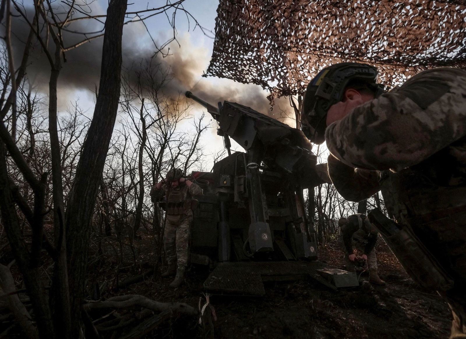 <i>Anatolii Stepanov/Reuters via CNN Newsource</i><br/>A Ukrainian soldier fires towards Russian troops at a position on the front line near Pokrovsk