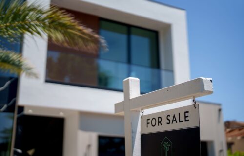 A "For Sale" sign in front of a home in the Encino neighborhood of Los Angeles