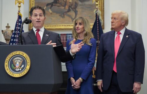 Michael Dell speaks as his wife Susan Dell and President Donald Trump look on while making an announcement about "Trump Accounts."