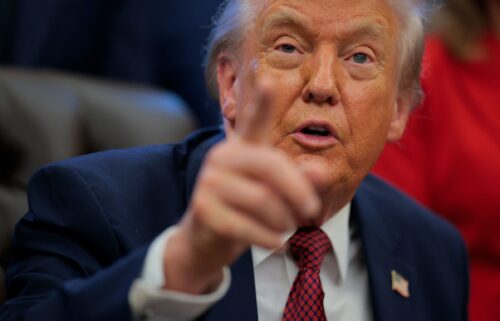 President Donald Trump takes questions from the press in the Oval Office on Wednesday.