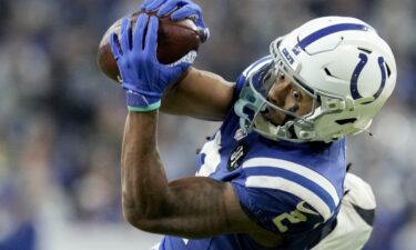 Green Bay Packers wideout Dontayvion Wicks dives for a touchdown against the Detroit Lions at Ford Field on November 27.