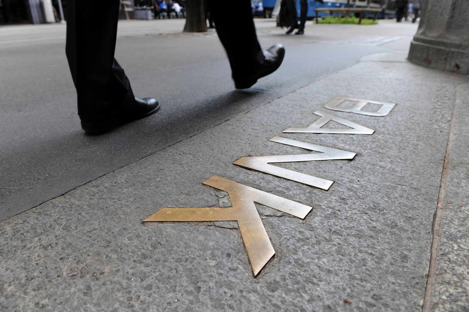 <i>Peter Frommenwiler/Bloomberg/Getty Images/FILE via CNN Newsource</i><br/>A pedestrian outside the UBS headquarters in Zurich