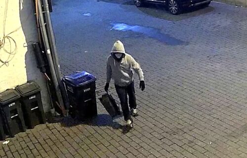 A surveillance photo released by the FBI shows a person suspected of leaving pipe bombs at the Republican and Democratic National Committee headquarters in Washington