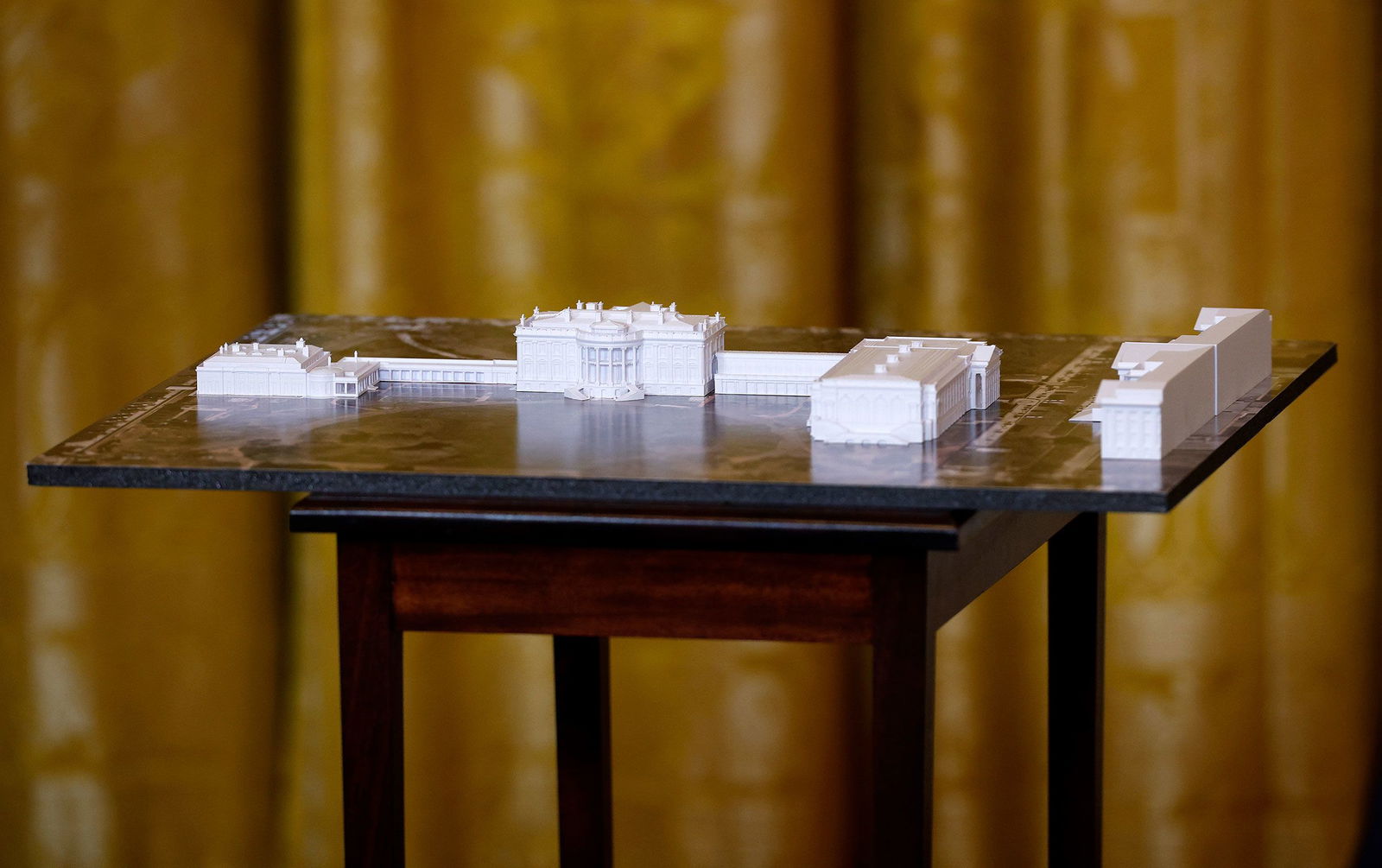 <i>Kevin Dietsch/Getty Images/File via CNN Newsource</i><br/>A model of the White House and proposed ballroom is displayed during a fundraising dinner with President Donald Trump in the East Room of the White House on October 15.